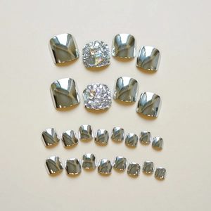 Glossy silver metallic press-on toenails with rhinestone accents in 24-piece set