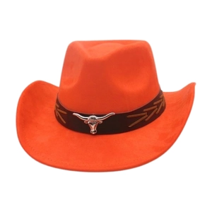 Detailed close-up of an orange suede cowboy hat with a silver bull head metal emblem