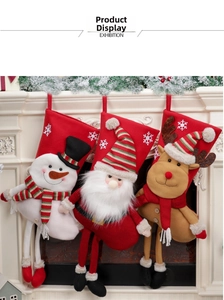 Three Christmas stockings with 3D Santa, snowman, and reindeer hanging on a mantel