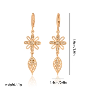 Detailed view of floral champagne gold earrings with cubic zirconia and size dimensions
