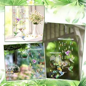 Detail of DIY hummingbird diamond painting wind chime hanging in a sunlit garden setting
