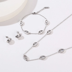 18K gold-plated teardrop necklace, bracelet, and earrings set with clear oval crystals