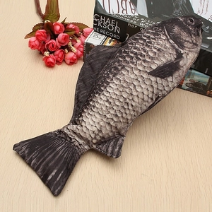 Realistic silver crucian carp fish pencil case with 3D print and zipper on a desk