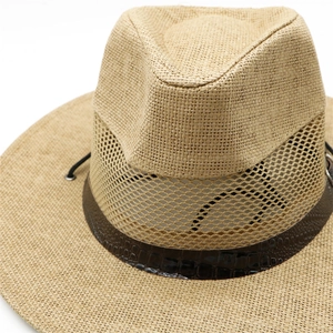 Close-up of khaki straw fedora featuring breathable mesh crown and crocodile leather band