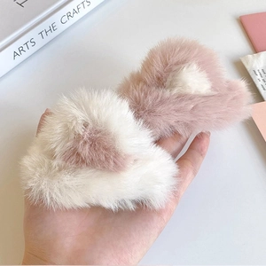 Plush cat ear hair clips in pink and white faux fur for cute autumn hair styling