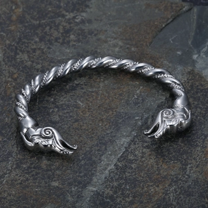 Retro stainless steel Viking bangle with twisted dragon head design on dark stone