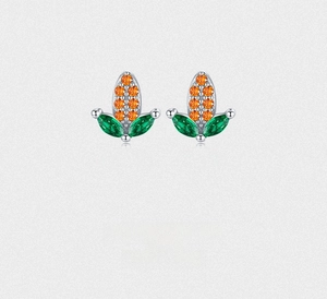 Macro shot of S925 silver corn earrings with orange gems and green marquise stones