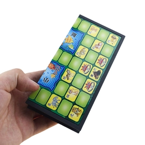 Hand holding a compact 15cm foldable magnetic Jungle Game board with animal icons