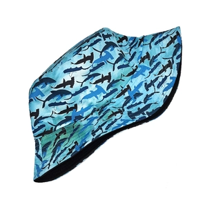 Detailed close-up of the shark pattern camouflage fabric on the blue bucket hat