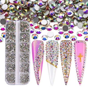 Macro shot of 12-slot storage box with AB crystals and nail art application examples