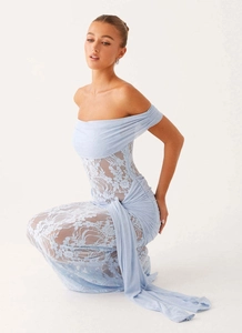 Detail of light blue off-shoulder dress featuring floral lace skirt and pleated bodice texture