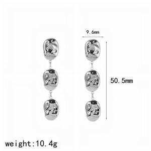 Detail view of triple-layered irregular hammered teardrop earrings in silver steel