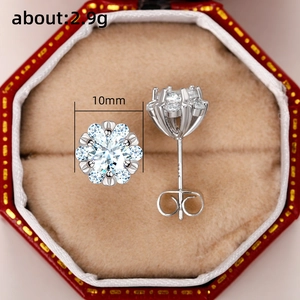 Detail of 10mm flower crown silver earrings with zircon in a red luxury jewelry box