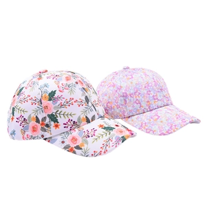Close-up detail of floral pattern on children's baseball caps for outdoor sun protection