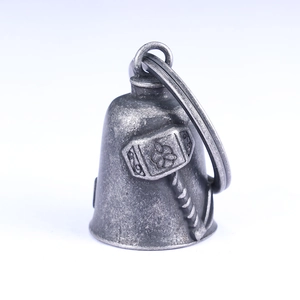 Antique silver Viking Mjolnir bell pendant with Thor's hammer relief on white background