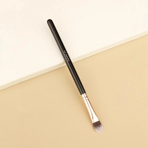 Tongue-shaped concealer brush with rose gold ferrule and black handle by Rancai