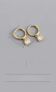 Detailed view of S925 sterling silver hoop earrings with round cubic zirconia pendant