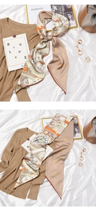 Detailed pattern of silk scarf featuring gears, clocks, and rabbits on white satin cloth