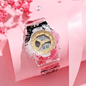 Detail of anime style digital watch with pink graffiti strap and gold dial display