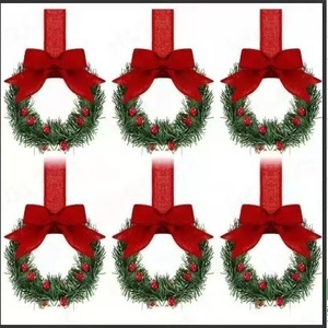 Set of six mini Christmas wreaths with pine needles, red bows, and berries for decor