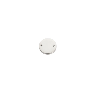 Close-up of circular stainless steel tag with double holes and silver brushed finish