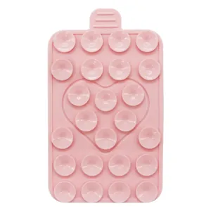 Detailed macro view of pink silicone suction pad with 24 suctions and heart pattern