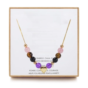 Detail of 6mm healing gemstone necklace with heart pendant in a kraft paper gift box