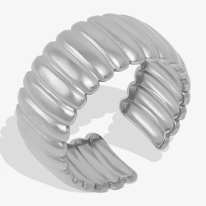 Detailed view of wave-textured silver croissant open ring with elegant metallic finish
