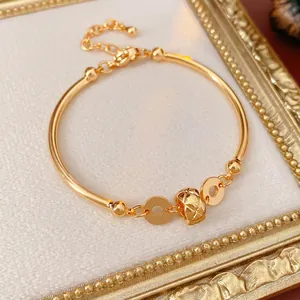 18K gold plated bangle bracelet with quilted pattern bead and luxury circular charms