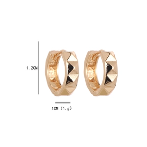 Macro shot of gold geometric earrings showing 1.2cm height and 1cm width dimensions