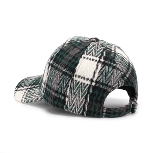 Macro detail of plaid baseball cap texture with adjustable silver metal buckle