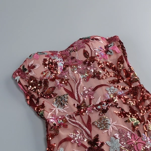 Detail view of high-density floral sequins and 3D embroidery on pink mesh evening gown