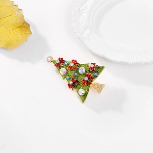 Exquisite Christmas tree brooch with green enamel, red bows, and colorful rhinestones