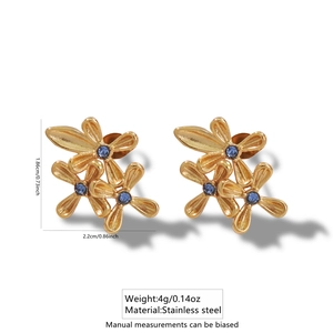 Detailed view of gold flower earrings with blue rhinestones showing exact dimensions