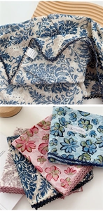 Detail of 100% cotton floral scarves featuring vintage paisley and lace trim edge