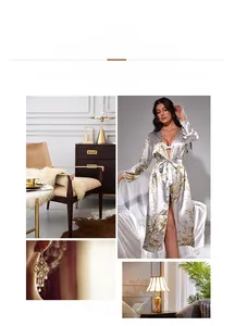 Detail of elegant satin floral print robe featuring smooth silk texture and golden patterns