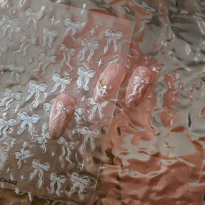 5D-geprägte Nagelaufkleber mit weißen Schleifen und funkelnden Sternelementen für Maniküre