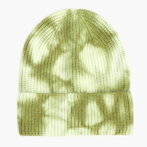 Detailed texture of green tie-dye knit beanie with wide folded cuff for winter warmth