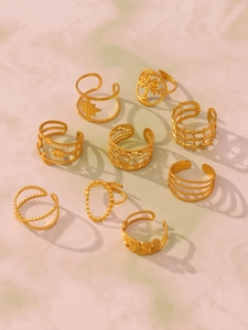 Set of 9 gold-plated irregular geometric rings featuring boho moon and sun textures