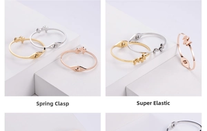Detail of butterfly bangles with spring hinges in gold, silver, and rose gold finish
