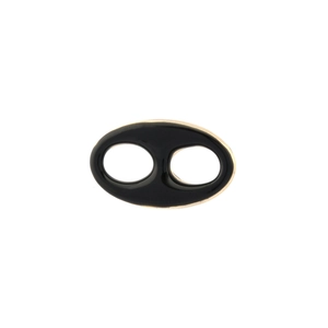 Detail of a black enamel and gold plated oval link accessory for jewelry making