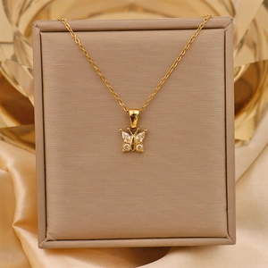 Detail of 18K gold plated titanium necklace with crystal zircon butterfly pendant
