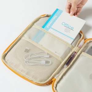 Detail of multi-functional laptop sleeve interior with mesh pockets and pen holders