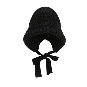 Winter black knit earflap bonnet hat with chin straps for warmth and stylish wind protection