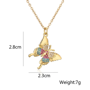 Detail view of gold butterfly pendant showing dimensions 2.8cm and 7g weight specs
