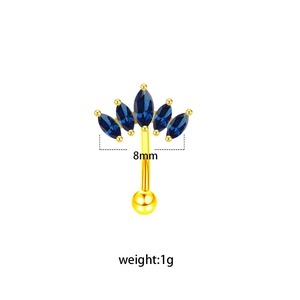 Detail of 8mm gold piercing jewelry featuring five marquise-cut deep blue zircon gems