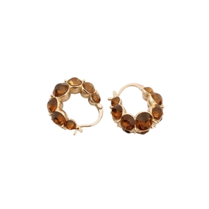 Vintage gold plated round hoop earrings with amber crystal stones on a white background