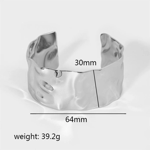 Macro detail of 30mm wide hammered texture stainless steel cuff bangle with measurements