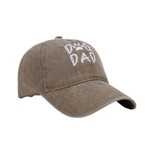 Classic washed cotton baseball cap with Dog Dad embroidery and paw icon in khaki brown