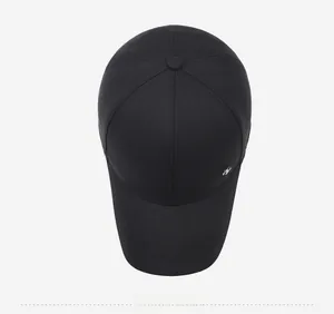 Top view of a black cotton baseball cap with wide brim and silver N logo detail
